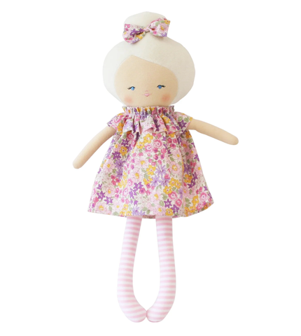 Image of Toy doll with floral dress and striped legs on a white background